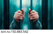 Concept: Captivity. Hands gripping prison bars, a symbol of confinement and longing for freedom. Стоковое AI-изображение, AI-художник Данила Большаков / Фотобанк Лори