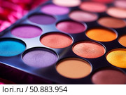 Colorful eyeshadow palette showing vibrant, matte and shimmery makeup colors. Стоковое AI-изображение, AI-художник Иван Рябоконь / Фотобанк Лори