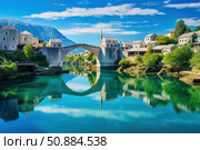Stari most reflecting in neretva river under blue sky in mostar, bosnia and herzegovina. Стоковое AI-изображение, AI-художник Иван Рябоконь / Фотобанк Лори