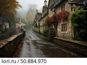 Wet street winding through charming stone cottages in cotswolds village on a foggy autumn day. Стоковое AI-изображение, AI-художник Иван Рябоконь / Фотобанк Лори