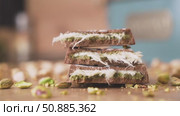 Dubai chocolate with crushed pistachios close up panning shot. Стоковое видео, видеограф Mihail Mihaylov / Фотобанк Лори