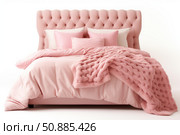 Comfortable pink bed with tufted headboard and knitted blanket inviting relaxing sleep. Стоковое AI-изображение, AI-художник Иван Рябоконь / Фотобанк Лори