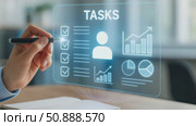 Hand interacting with digital task management interface. Shows checklists, charts. Стоковое AI-видео, аниматор Екатерина Усенко / Фотобанк Лори