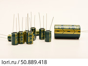 Electrolytic capacitors of different nominal values. Energy storage devices. Electronic radio elements. Стоковое фото, фотограф Valeriy Lushchikov / Фотобанк Лори