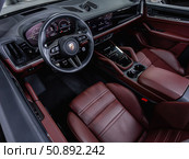 Novosibirsk, Russia -  July 14, 2025: Porsche Cayenne,  Prestige car interior with dashboard, steering wheel, speedometer and tachometer. Редакционное фото, фотограф Виталий Сова / Фотобанк Лори