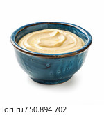 Creamy hummus bowl presenting smooth chickpea dip with olive oil drizzle. Стоковое AI-изображение, AI-художник Иван Рябоконь / Фотобанк Лори