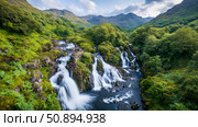 Glen Affric's Cascade: A scenic highland river with cascading falls through the verdant valley, framed by distant mountain ridges. Стоковое AI-изображение, AI-художник Данила Большаков / Фотобанк Лори