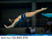 Diver in mid-air performing a graceful springboard dive with water splashing around. Стоковое AI-изображение, AI-художник Гайфуллина Дина / Фотобанк Лори