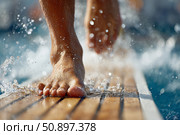 Diver's feet splashing water on springboard, preparing for an exhilarating dive into the pool. Стоковое AI-изображение, AI-художник Гайфуллина Дина / Фотобанк Лори