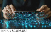 Human hands holding a sleek smart device generating an intricate glowing blue network of connected data. Стоковое AI-видео, аниматор Данила Большаков / Фотобанк Лори