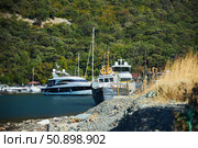 Utrish, Russia - September 07, 2022: Port and parking for yachts and ships. Редакционное фото, фотограф Наталия Кирсанова / Фотобанк Лори