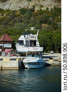 Utrish, Russia - September 07, 2022: Port and parking for yachts and ships. Редакционное фото, фотограф Наталия Кирсанова / Фотобанк Лори