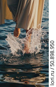 Barefoot prophet in tunic walking serenely across rippled sea surface, robe mirroring water while performing miraculous journey in Galilee. Стоковое AI-видео, аниматор Данил Руденко / Фотобанк Лори