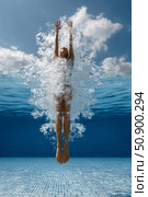 Diver performing a graceful springboard dive into a sparkling blue swimming pool. Стоковое AI-изображение, AI-художник Гайфуллина Дина / Фотобанк Лори