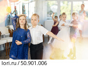 Preteen pupils rehearsing ballroom dance for festive school event. Стоковое фото, фотограф Яков Филимонов / Фотобанк Лори