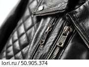 Black leather jacket with zippers and pockets and black leather stylish bag. Modern outerwear. Close-up. Fashion background. Autumn urban street clothes. Fashionable concept. Women's casual day outfit. Стоковое AI-изображение, AI-художник Марина Демидюк / Фотобанк Лори