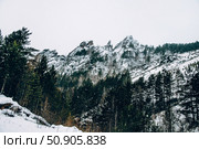 Landscape of Siberia mountains Stolbi, rock peak Takmak range in haze winter. Стоковое фото, фотограф Spirit River / Фотобанк Лори