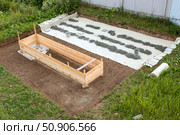 Construction site of a new house with a concrete floor and a wooden frame. Стоковое фото, фотограф Nobilior / Фотобанк Лори