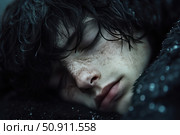 Close-up of a sleeping teenager with freckles and dark curly hair. The face expresses peace and vulnerability, while the soft light highlights the natural texture of the skin. The scene creates an atmosphere of silence, privacy and fragility, ideal for themes related to sleep, feelings, youth and the inner world. The photograph conveys emotional depth and aesthetic calm. Стоковое AI-изображение, AI-художник Анна Кривицкая / Фотобанк Лори