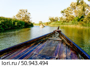 Wooden boat yacht sailing on water Skadar Lake in Montenegro, summer landscape (2024 год). Стоковое фото, фотограф Spirit River / Фотобанк Лори