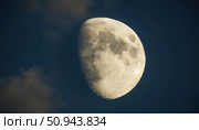 A large, full moon is shining brightly in the night sky. Стоковое AI-изображение, AI-художник Ярославский Максим / Фотобанк Лори