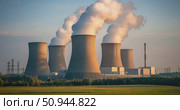 Cooling towers release steam at a nuclear power plant during golden hour. Стоковое AI-видео, аниматор Александр Довянский / Фотобанк Лори