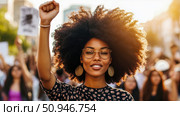 Activism concept: Confident woman raising fist in peaceful demonstration. Стоковое AI-изображение, AI-художник Данила Большаков / Фотобанк Лори