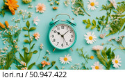 Concept: Spring Time; Design for print: Clock surrounded by a flower arrangement showing the passing of time. Стоковое AI-изображение, AI-художник Данила Большаков / Фотобанк Лори