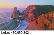Ursa Beach, Cliffs and Atlantic Ocean Waves at Sunset. Portugal. Aerial View. Стоковое видео, видеограф Максим Забаровский / Фотобанк Лори