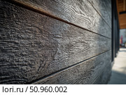 Modern brown wood plank texture. Fiber cement siding. Exterior of composite wall. Plastic material is eco-friendly polymer panels in rows. Wooden grain surface. Hollow WPC boards. Dark oak color. PE. Стоковое AI-изображение, AI-художник Марина Демидюк / Фотобанк Лори