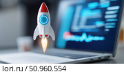 3D rocket launching from a laptop keyboard with blurred code on screen, symbolizing startup growth, innovation, and digital technology in a modern workspace. Стоковое AI-изображение, AI-художник Катерина Бондарец / Фотобанк Лори
