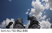 Wingsuit skydiver plummeting through bright white clouds, embracing high altitude adrenaline against vibrant blue sky backdrop. Стоковое AI-видео, аниматор Данил Руденко / Фотобанк Лори