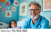 A compassionate male doctor smiles brightly, wearing blue scrub and a stethoscope, offering reassurance to a patient in a caring medical clinic setting. Стоковое AI-изображение, AI-художник Данила Большаков / Фотобанк Лори