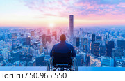 A contemplative person in a wheelchair views a sprawling city during a vibrant sunrise, symbolizing resilience, urban ambition, and an accessible future. Стоковое AI-изображение, AI-художник Данила Большаков / Фотобанк Лори