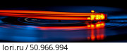 Dynamic illumination of a spinning vinyl record player tonearm, evoking retro music and modern sound waves, suitable for abstract art or music album covers. Стоковое AI-изображение, AI-художник Данила Большаков / Фотобанк Лори