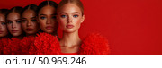 Diverse beauty lineup showcasing a spectrum of skin tones from fair to dark against a vibrant red backdrop, emphasizing inclusivity and facial features. Стоковое AI-изображение, AI-художник Данила Большаков / Фотобанк Лори