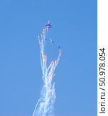 Performance of aerobatic team Russian Knights at the air showOmsk, Russia - 19 March, 2016: Performance of Russian Knights at the air show. Редакционное фото, фотограф Александр Карпенко / Фотобанк Лори