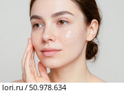 Young beautiful woman with hydrogel patches under her eyes. Concept for skincare beauty treatment and modern anti aging cosmetology. Стоковое AI-изображение, AI-художник Павел Муравьев / Фотобанк Лори
