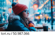 Winter Solace: pensive young woman in cozy red beanie and dark coat sips coffee while observing blurred, festive outdoor scene through window. Стоковое AI-изображение, AI-художник Данила Большаков / Фотобанк Лори