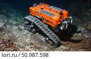 An underwater robotic vehicle designed for deep sea mining. Стоковое AI-изображение, AI-художник Евгения Пархоменко / Фотобанк Лори