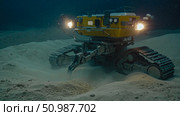A deep-sea mining robot operates on the ocean floor. It has tracks and lights. Стоковое AI-изображение, AI-художник Евгения Пархоменко / Фотобанк Лори