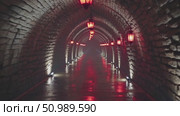 Crimson paper lanterns suspended from stone tunnel ceiling, glowing softly through misty night, creating atmospheric luminescence with traditional Asian ambiance. Стоковое AI-видео, аниматор Данил Руденко / Фотобанк Лори