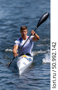 Canoe sprint kayaker paddling during competition on lake. Стоковое фото, фотограф Юрий Поздников / Фотобанк Лори