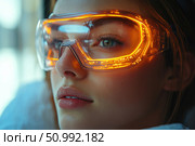 Close-up of a girl's face in futuristic glasses with bright neon lighting. The glasses are made in the cyberpunk style with elements of a digital interface. The technological image is combined with natural beauty, conveying the atmosphere of the future, high technology and virtual reality. Suitable for the theme of innovation, cyber aesthetics, digital fashion and science fiction. Стоковое AI-изображение, AI-художник Анна Кривицкая / Фотобанк Лори