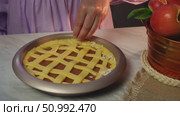 Seamless apple pie lattice top preparation by woman in purple dress. Стоковое видео, видеограф Zakharova Natasha / Фотобанк Лори