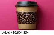 Take Away Coffee Cup Mockup: Brown Paper Cup with Coffee Beans Sleeve on Pink Surface. Стоковое AI-изображение, AI-художник Данила Большаков / Фотобанк Лори