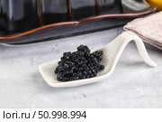 black sturgeon caviar in the bowl. Стоковое фото, фотограф Андрей Старостин / Фотобанк Лори