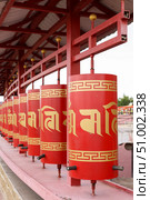 Elista, capital of Republic of Kalmykia, Russia, July, 4, 2025: Prayer drums of khurul, Buddhist temple Golden Abode of Buddha Shakyamuni, largest Buddhist temple in Europe. Редакционное фото, фотограф Екатерина Топорова / Фотобанк Лори