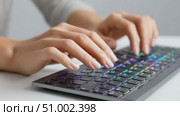 Woman programmer typing on rgb keyboard. Стоковое AI-видео, аниматор Юрий Поздников / Фотобанк Лори