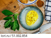 Roasted cottage cheese with turmeric and cumin on plate with baguette and greens. Стоковое фото, фотограф Яков Филимонов / Фотобанк Лори